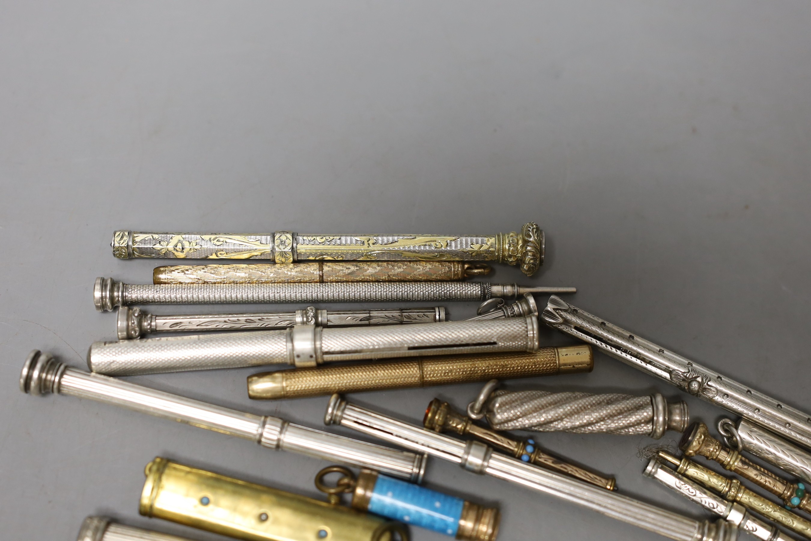 A collection of assorted white and base metal propelling pencils, etc.